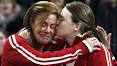 An emotional Cheryl Bernard, left, gets a kiss from teammate Susan O'Connor ... - bernard-oconnor-091212-306