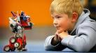 INSPECTING THE GADGET: Liam Goode, 6, has his eye on this Transformer toy, ... - 145709