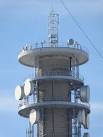 The diagonal support wire is from the adjacent TV tower next door - via Daymix