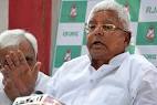 Lalu Yadav taunts Baba Ramdev; to march BJP HQ over Jan Dhan.