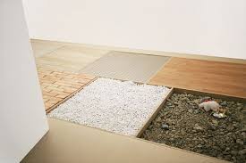 Sonia Leimer Series of Successive Instants, 2009. Press board, concrete, gravel, debris, laminate, brick, aluminium, ceramic-flags, video-projection, text, - Sonia_Leimer