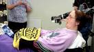 Robotic arm controlled by the mind allows paraplegic woman to feed