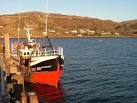 The Stornoway registered "Astronaut" fishing boat sits alongside Uig pier. - via Daymix