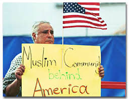 University of Arizona professor of radiology and nuclear medicine Fayez Swailem holds a sign pleading for UA and the United States to understand the Muslim ... - 01_2_i