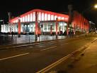 Wembley Arena: floodlit in red. The colours of the floodlights were changing - via Daymix