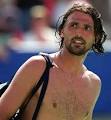 Goran Ivanisevic of Croatia leaves the court topless after his win against ... - 18aus1