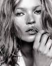 Kate Moss poses topless in