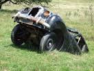 An old Austin (I believe) half buried in the field just west of Curtis Wood - via Daymix