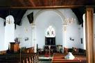 glass window above the altar depicts Christ meeting with St Philip - via Daymix