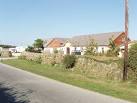 A farm, caravan site, - via Daymix