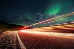 northern lights over roads of alaska photo