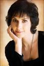 ... (anglicized Enya Patricia Brennan) in Country Donegal, Ireland in 1961. - enya-smile-one-hand1