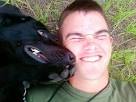 By MARK COLLETTE For Scripps Howard News Service - Pfc.-Colton-Rusk-with-bomb-sniffing-dog-Eli