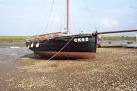 Sid's pride. Old wooden Bawley on the hard at Tollesbury. - via Daymix