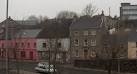 The pink building is the Bridgend Inn, known as Bert's Bar. The rundown - via Daymix
