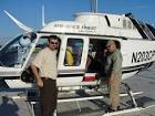 Men stands near helicopter public domain image picture in gallery - via Daymix