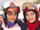 Two female skiers grabbed