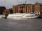 Phoenix Wharf, King Henry's Wharves. Thames river boat moored beside old - via Daymix