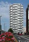 of having its own nicknames, first the 'Threepenny Bit Building' and, - via Daymix