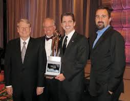 From left: UT Dallas President David E. Daniel and IEE Executive Director Dr. Joseph C. Picken celebrate with Microtransponder CFO Frank McEachern and CEO ... - tech-titans-2010-08