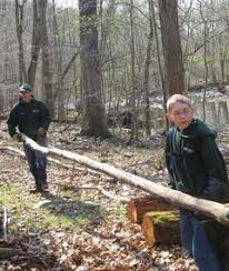 MAKING PROGRESS — Troop 251 Scout Leader Mark Hurban and Scout Denny Kager prepare to set a log that will mark a trail leading to High Falls in the ... - pix-0415kingscoutsjpg-a2d56b355768f889_medium