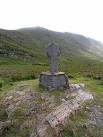 Cross above Doo Lough. This cross standing by the R335 road to the south of - via Daymix