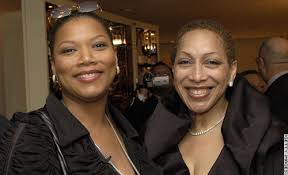 Singer and actress Queen Latifah and her mother, Rita Owens, smile broadly for the camera at Latifah\u0026#39;s surprise birthday in March 2003. - gallery.11.gi