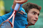 Seventh seed Gilles Simon is victorious in front of a happy home crowd with ... - _45831578_simon