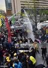 Police use a water cannon during clashes with South Korean.