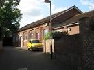 The library uses the grey door, the small medical centre uses the pink door. - via Daymix