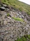 Wall alongside the track over Lingy Pits Breast - via Daymix