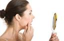 This week's reader skin question is being fielded by Dr. Dendy Engelman, ... - woman-checking-mirror
