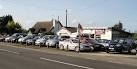 Morel's used cars. Photographed from the adjacent OS grid square - which is - via Daymix