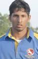 Saami Siddiqui stands at