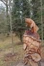 Near it is a counterpart sculpted seat illustrating a Native American - via Daymix
