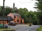 The red and black flag on the pub is that of the Down GAA club. - via Daymix