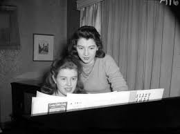 Dora and Jean Mainwaring at their piano] - City of Vancouver Archives - 9c8ae88c-b472-479c-889c-3452a2bdea93-A10500