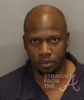 Norman posed for the mugshot