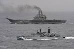 David Vs Goliath of the water: British warship is dwarfed by