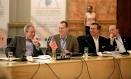 President George W. Bush is seated next to Robert J. Stevens ...