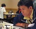 Filipino Alfredo Paez (foreground) grinding out a win with Black while ... - dato41