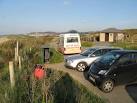 A rather untidy collection of bins grace the car park by one of the access - via Daymix