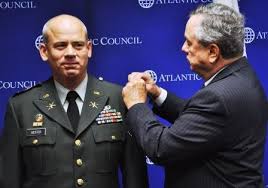 Hester was ceremoniously “pinned on” with his new rank by his wife, Teresa, and former Assistant Secretary of Defense Powell Moore (shown). - col-hesterjpg-7f749e25ecf3607f