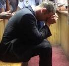 Oscar Pistorius breaks down in tears as he is charged with one