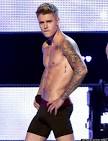 Justin Bieber Strips To His Calvin Klein Underwear, Shows Off.