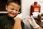 Dillon Miller, 7, gets an H1N1 vaccination from nurse Margie Silva at the ... - jwj-vaccine-0045