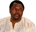 caption: Mike Adenuga. By Pastor Yomi Oluselu - Mike_Adenuga