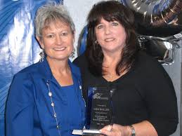 Ginger Martin, CEO and President, presents award to Lisa Boller ... - lisaannivp2