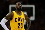 LeBron James cuts head falling head-first into crowd at NBA finals.
