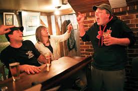 <b>Aaron Larrabee</b> takes shelter behind the bar at the Brooklin Pub during an <b>...</b> - Dukes_09